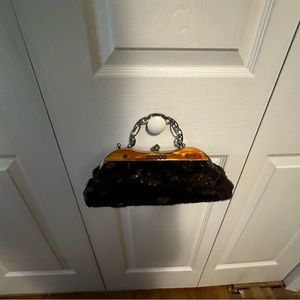 Brown sequined bag with beautiful metal handle